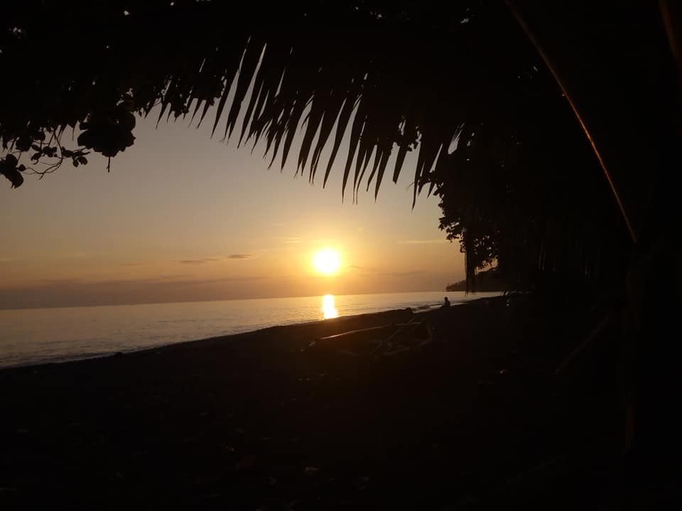 Sunset over the water from B-17 Dive and Beach Bungalows