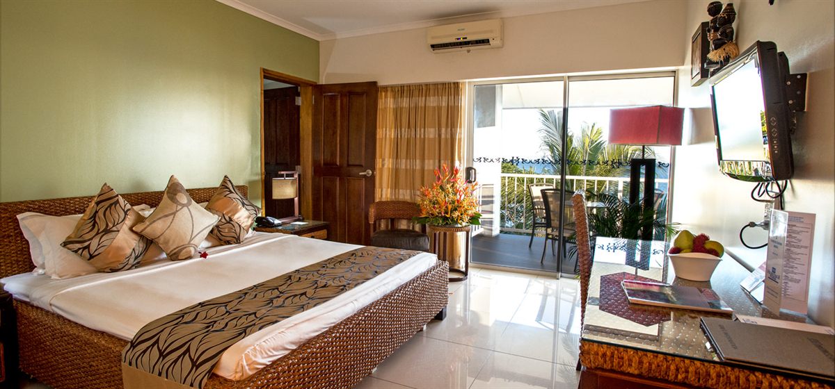 A guest room with its own balcony at Heritage Park Hotel