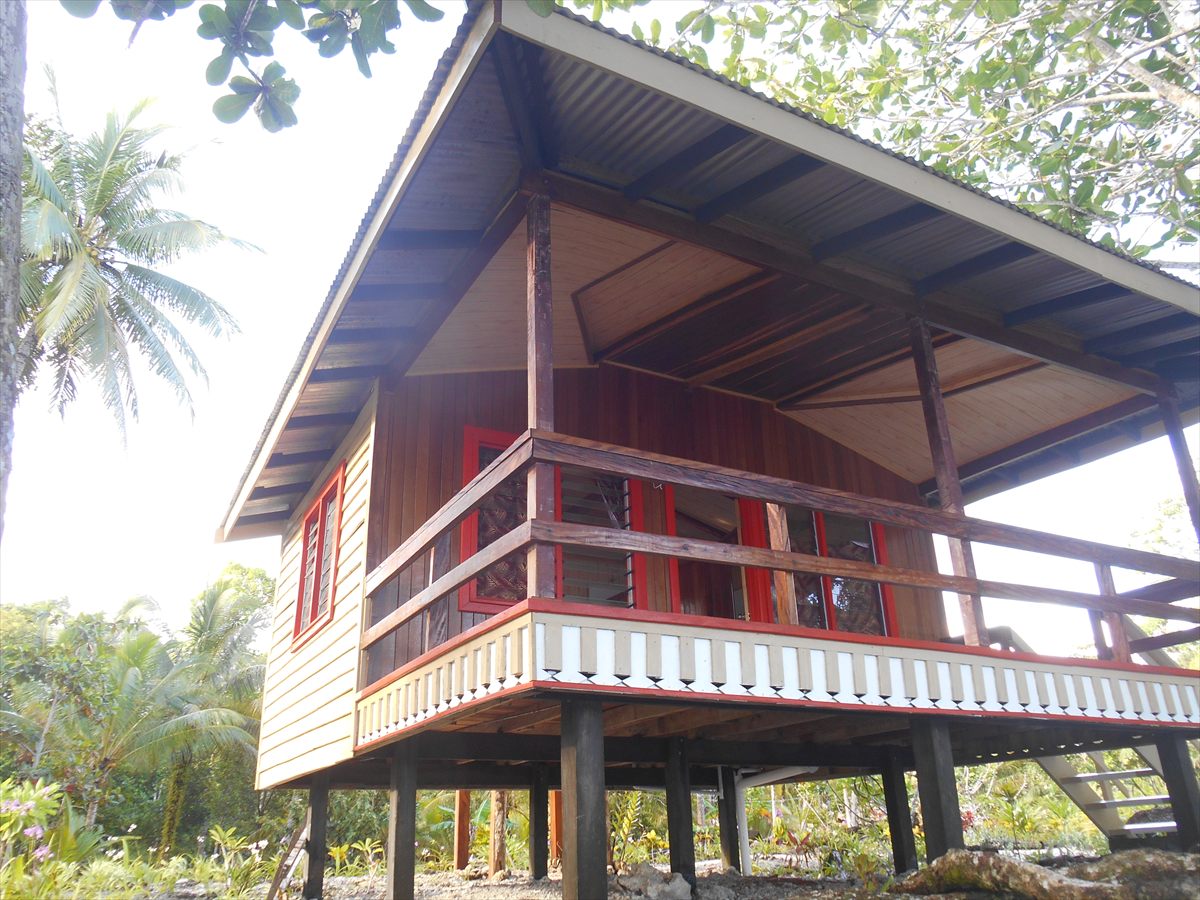 One of Leleana’s timber bungalows raised on stilts, with a wide covered verandah