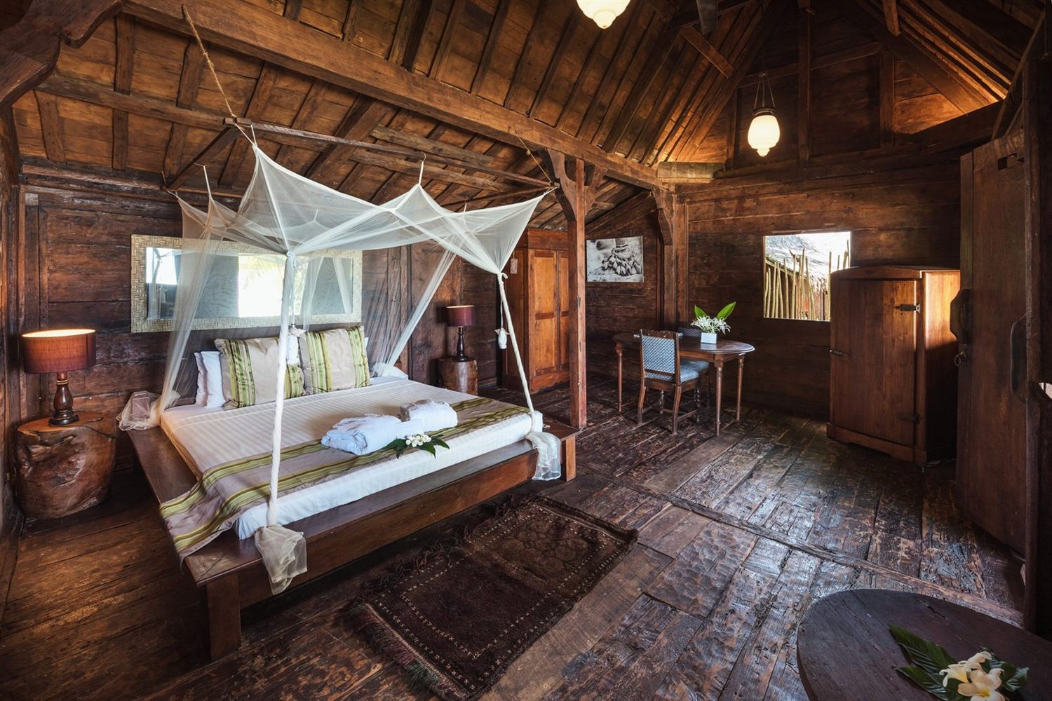 Antique teak villa interior at Ratua Private Island, Vanuatu