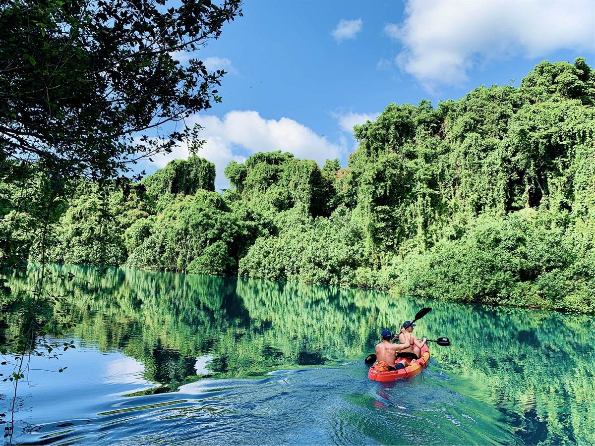 Kayaking a blue hole near Ratua Private Island, Espiritu Santo, Vanuatu