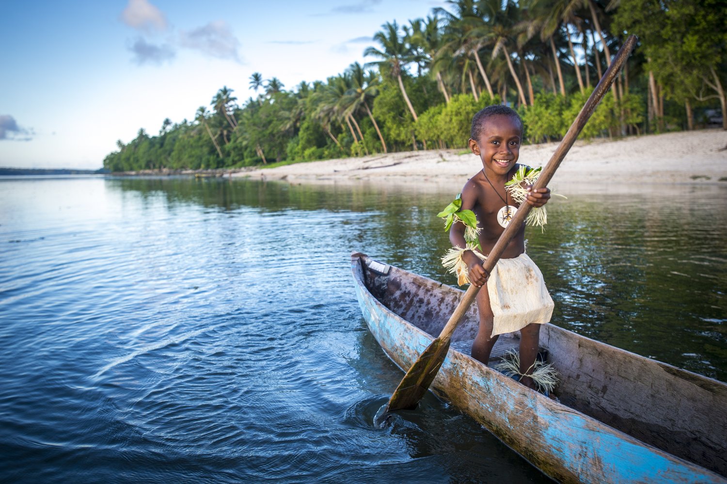 Solomon Islands village bay and traditional canoes